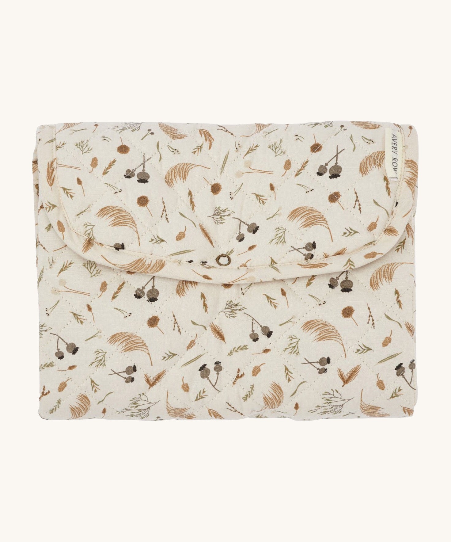 A light soft cream Avery Row travel changing mat with a grassland design on a cream background.