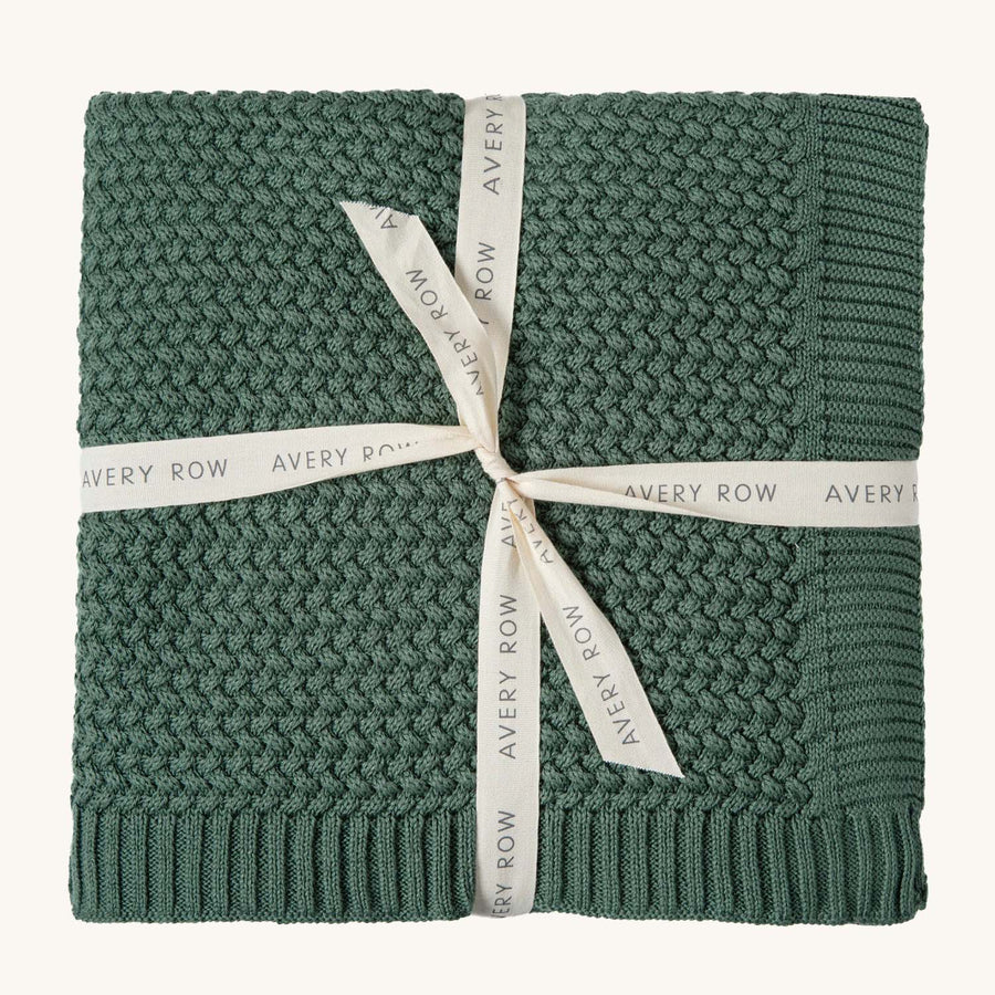 Avery Row Plait Knit Baby Blanket - Pine Green. A beautifully plait knitted baby blanket in a rich