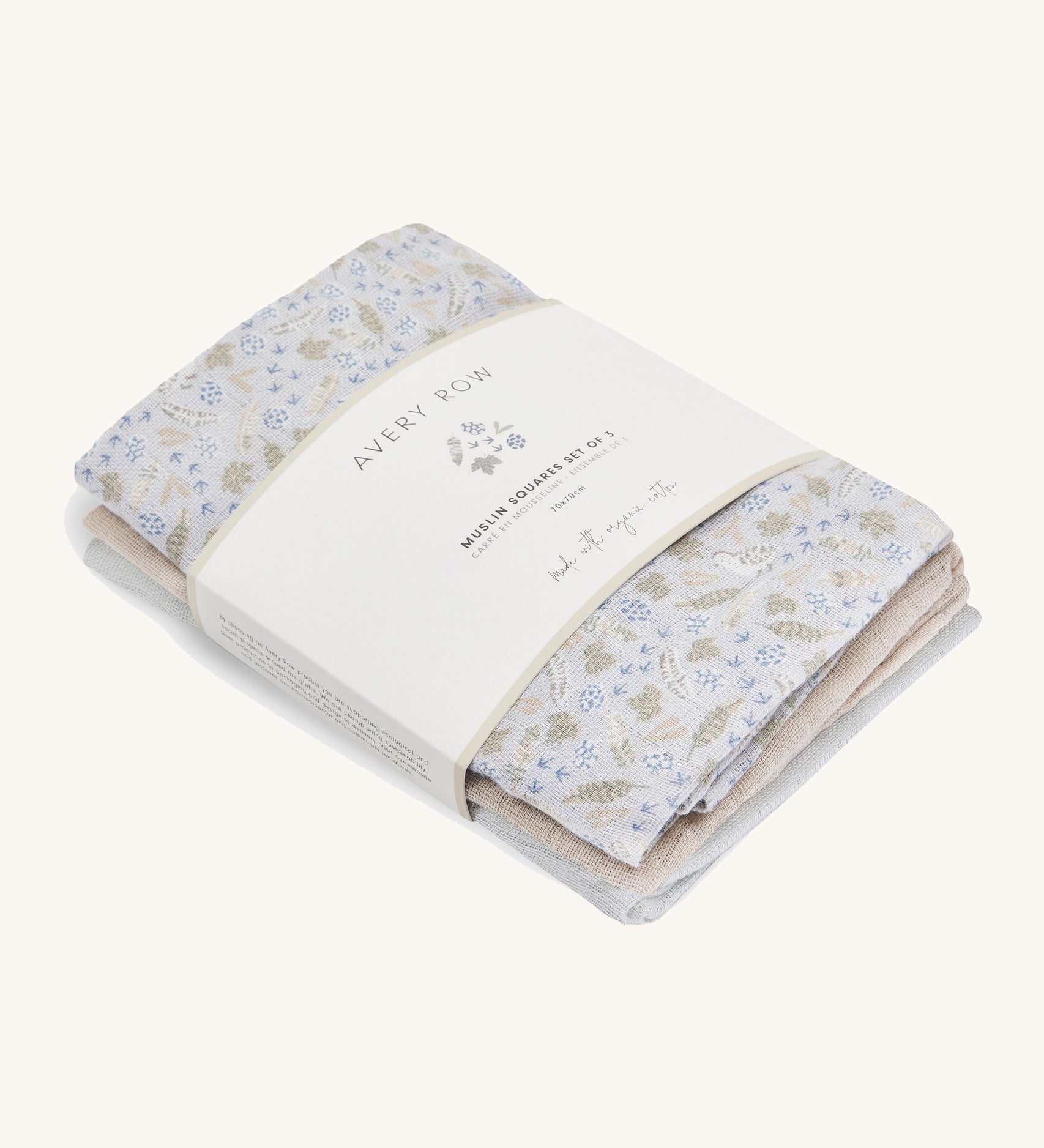 A soft Avery row muslin squares set of 3 including a light blue with a nature design, beige and light blue muslins on a cream background.