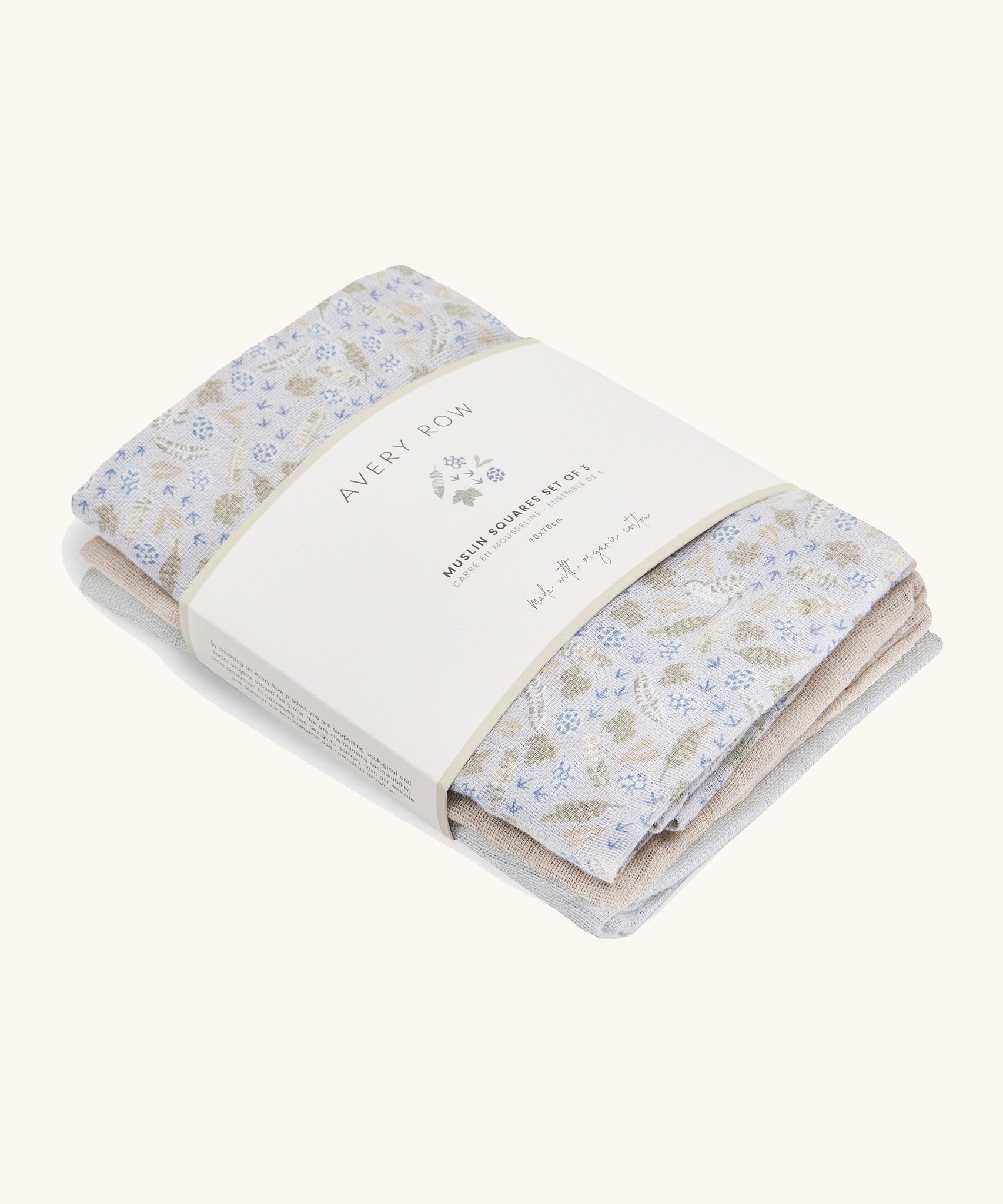 A soft Avery row muslin squares set of 3 including a light blue with a nature design, beige and light blue muslins on a cream background.