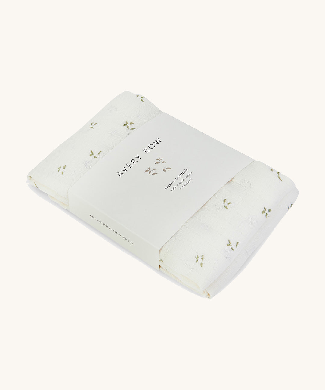 A soft light coloured Avery Row muslin square with a nettle design on a cream background.