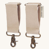 The pram clips included with the Avery Row Baby Changing Bag in a  Natural colour