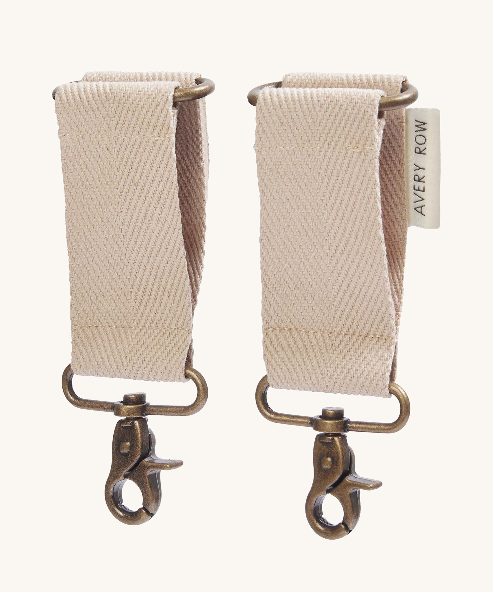 The pram clips included with the Avery Row Baby Changing Bag in a  Natural colour