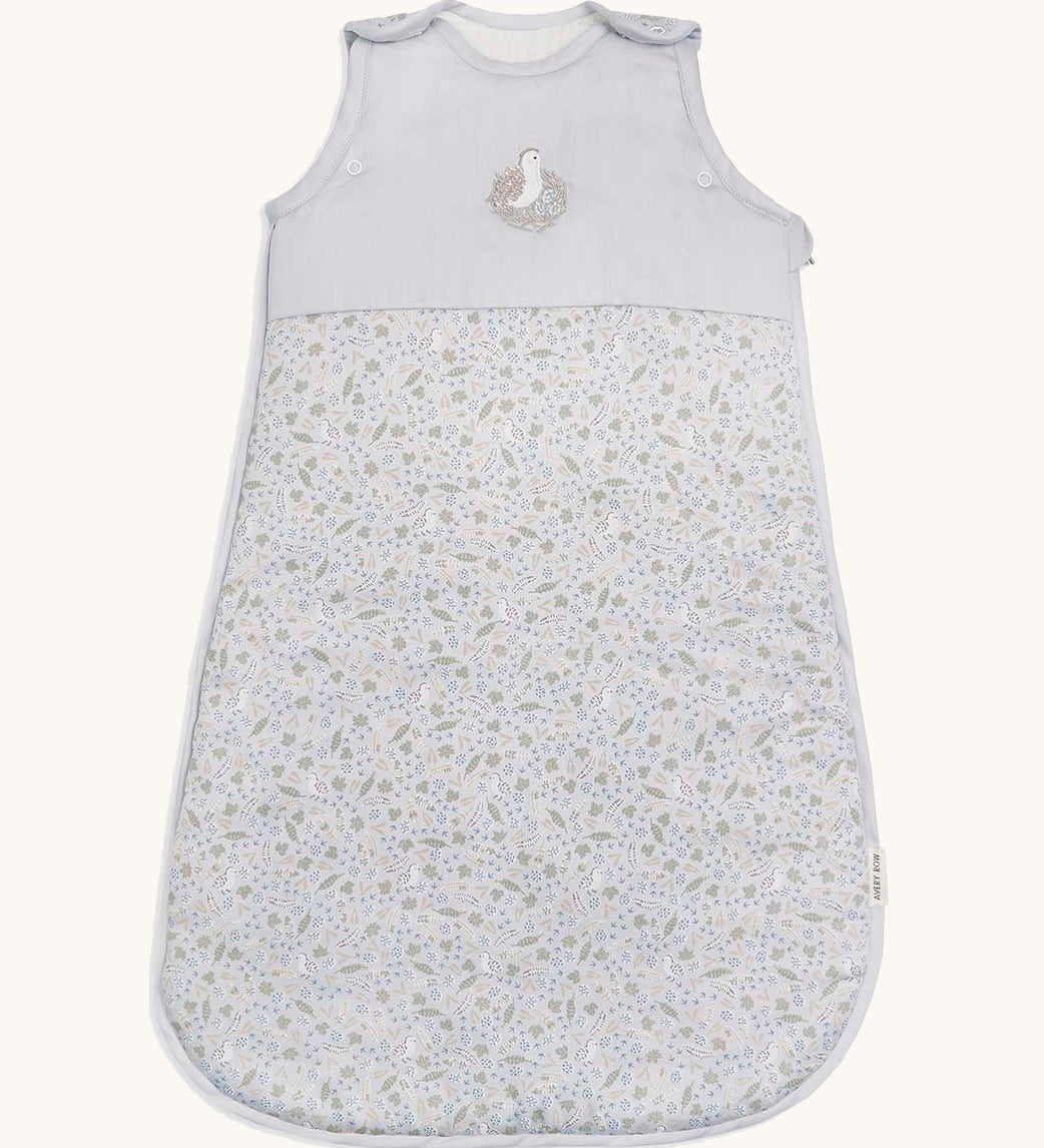 A light blue Avery row baby sleeping bag with a nature trails design on the front.