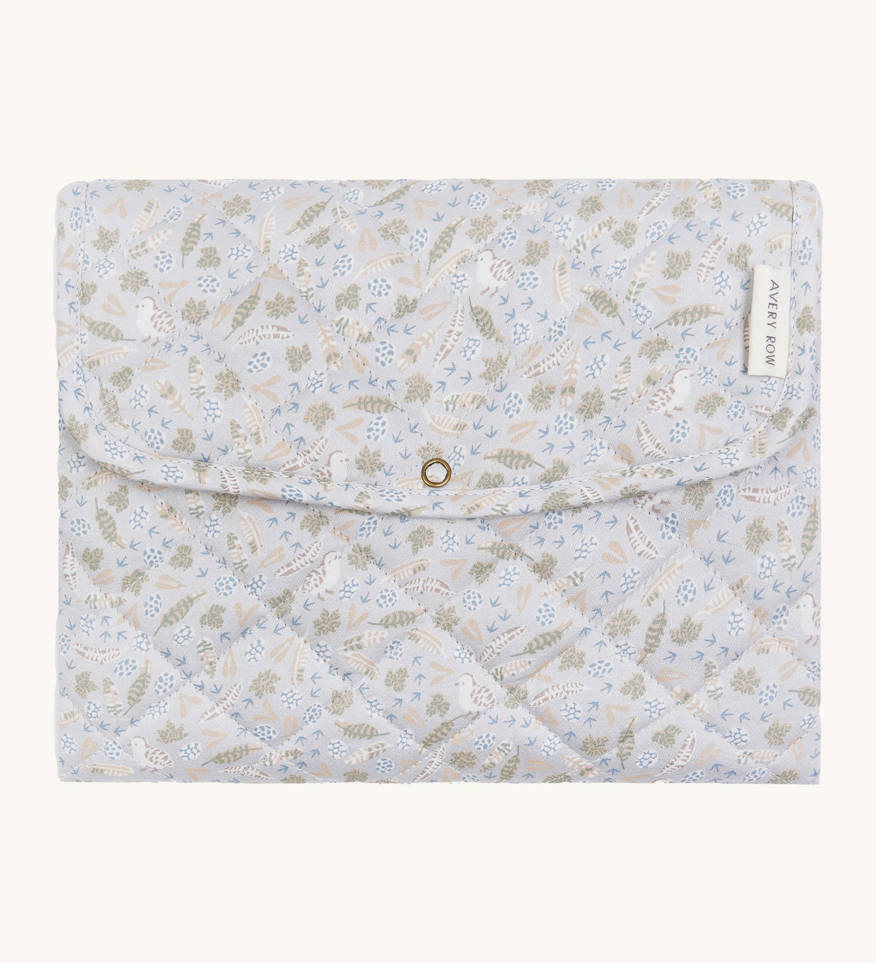 A soft light blue coloured Avery Row travel changing mat with a nature design on a cream background.