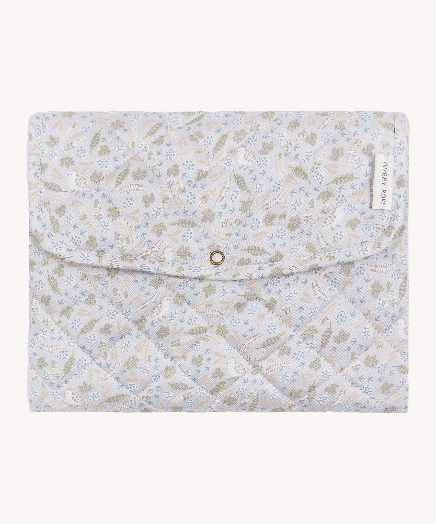 A soft light blue coloured Avery Row travel changing mat with a nature design on a cream background.