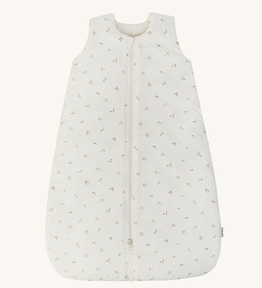 A light Avery row baby sleeping bag with a nettle design on the front on a cream background.