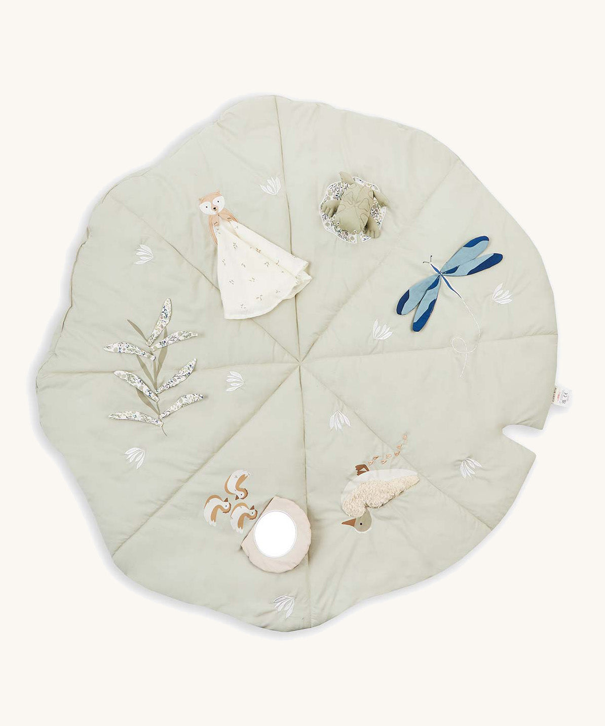 A soft light green Avery Row activity mat with a duck, dragonfly, frog, otter and flower on top of the mat on a cream background.