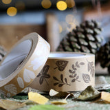 Babipur brown leaf print eco kraft paper tapes in front of some pine cones and brown leaves