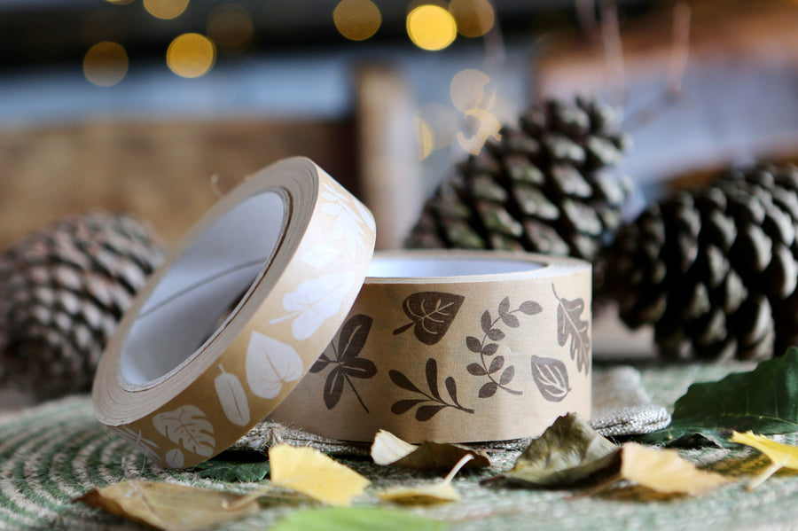 Babipur brown leaf print eco kraft paper tapes in front of some pine cones and brown leaves