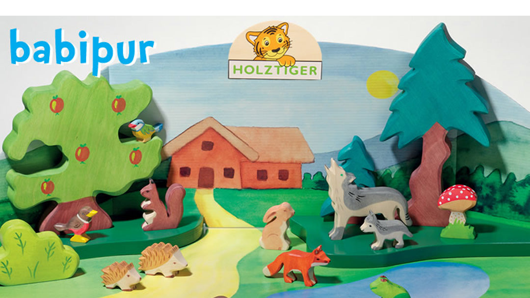 Wooden play scene featuring Holztiger wooden toy animals