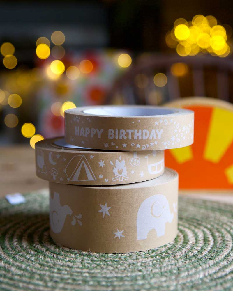 Stack of three brown paper tapes on a kitchen table.