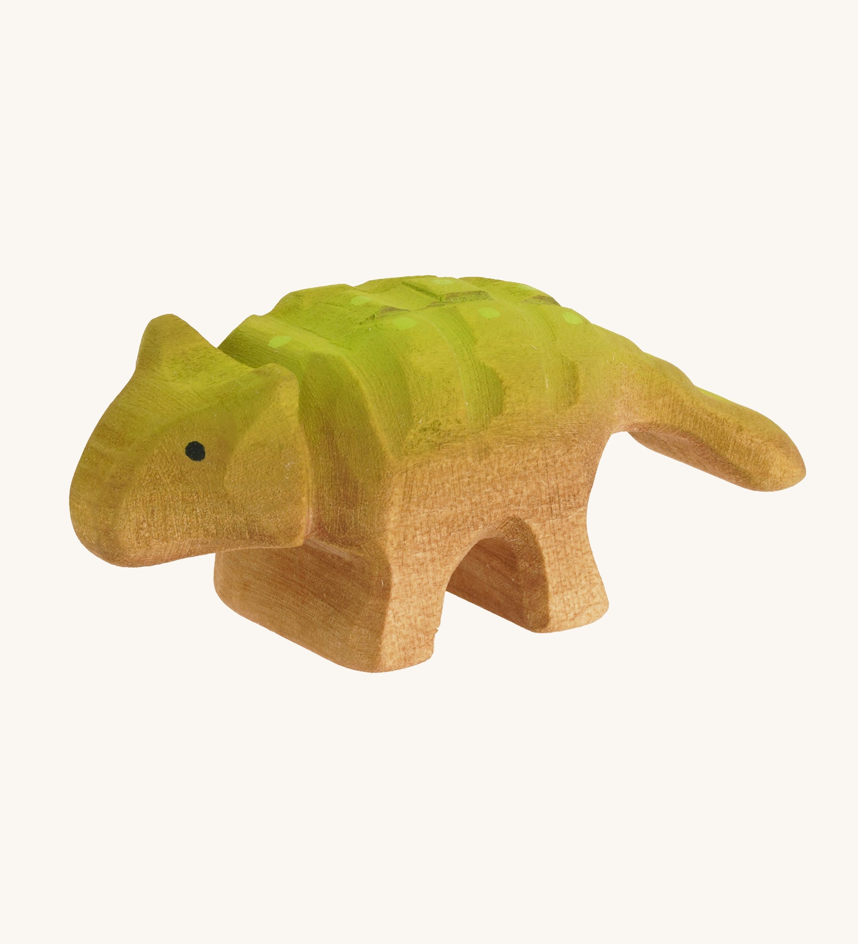 Green and light brown baby standing Akylosaurus on a cream background