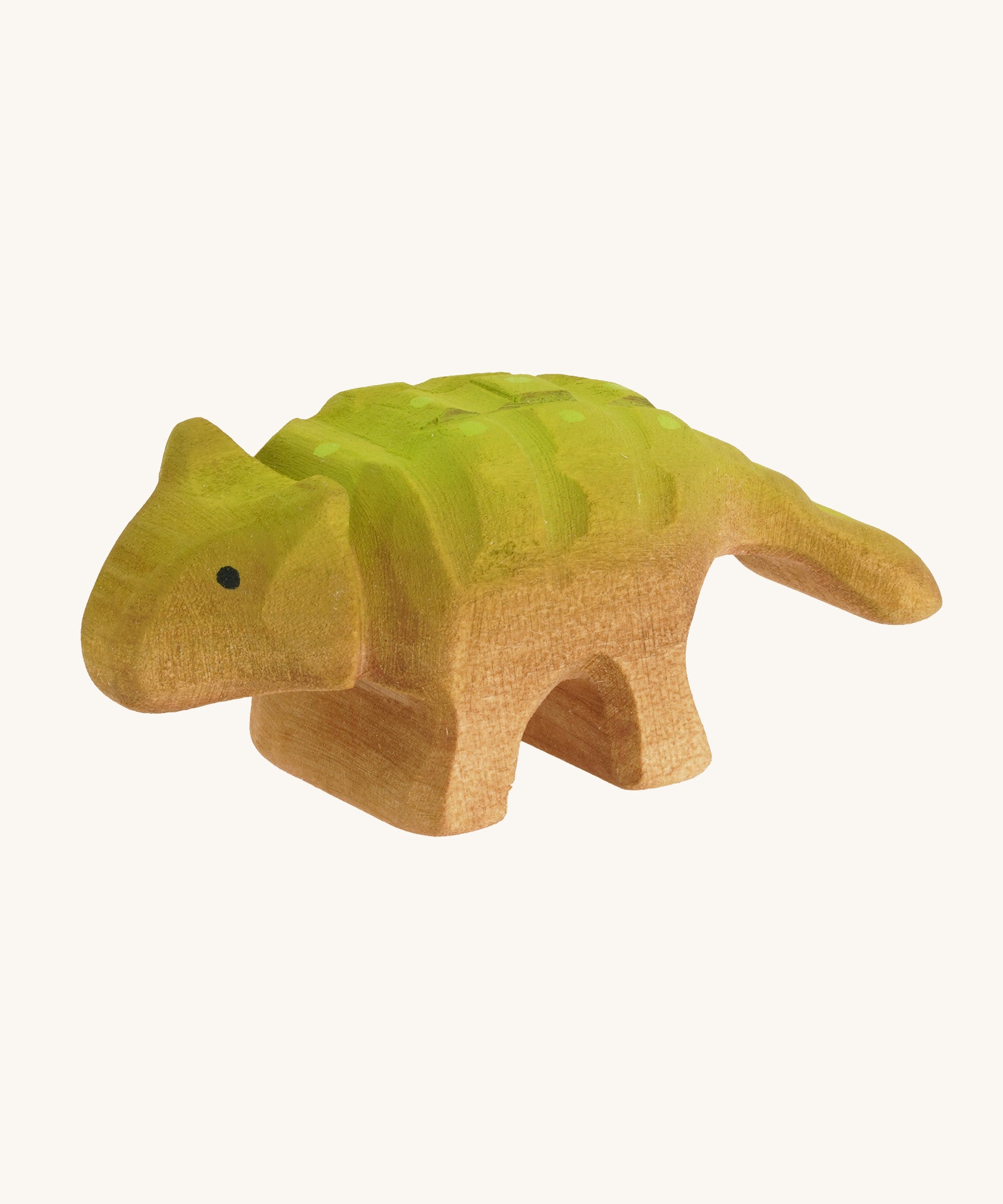 Green and light brown baby standing Akylosaurus on a cream background