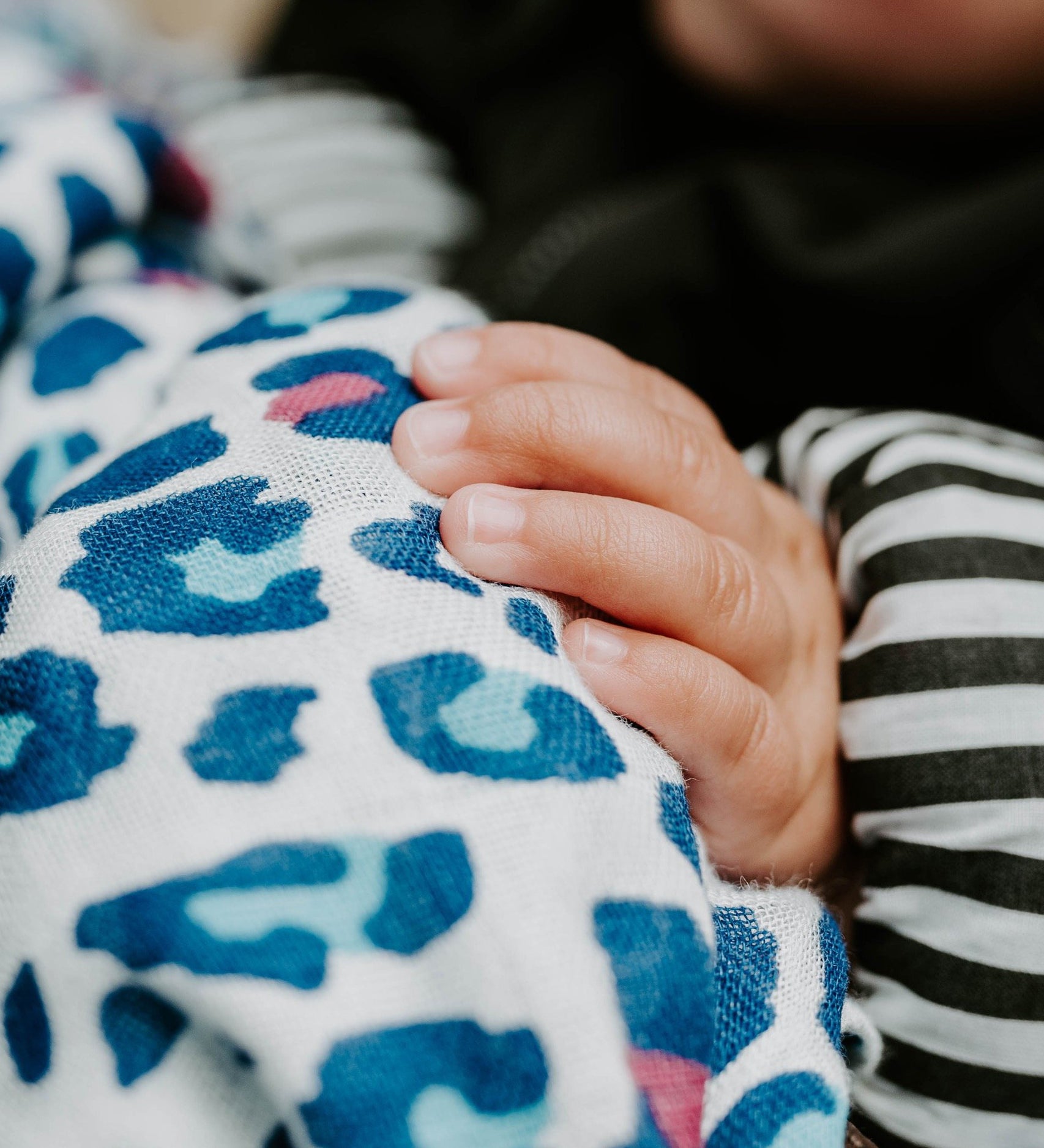 A closer look at the vibrant coloured print on the Etta Loves Extra Large Organic Cotton Baby Muslin Square - Blue Leopard