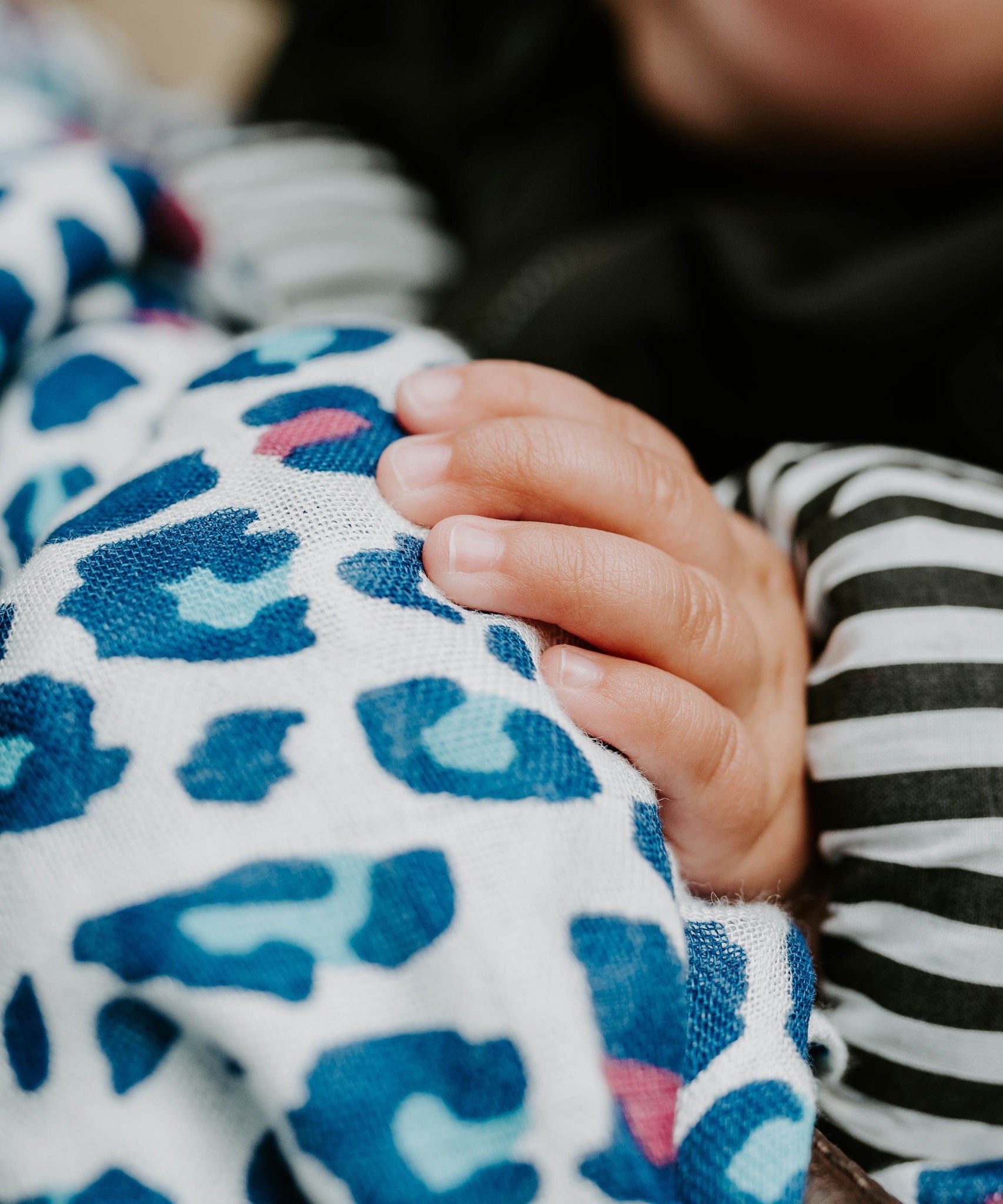 A closer look at the vibrant coloured print on the Etta Loves Extra Large Organic Cotton Baby Muslin Square - Blue Leopard