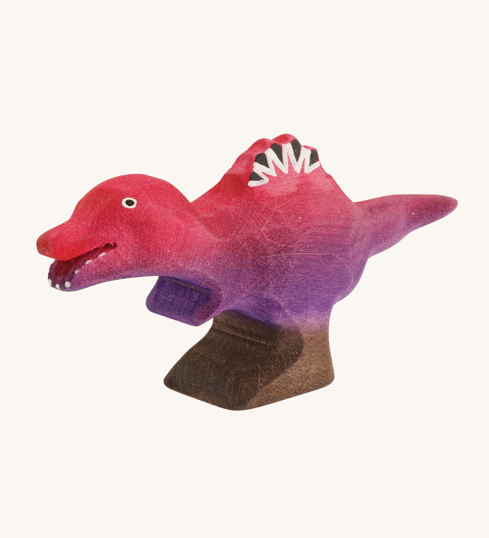 Pink and purple standing baby spinosaurus on a cream background 