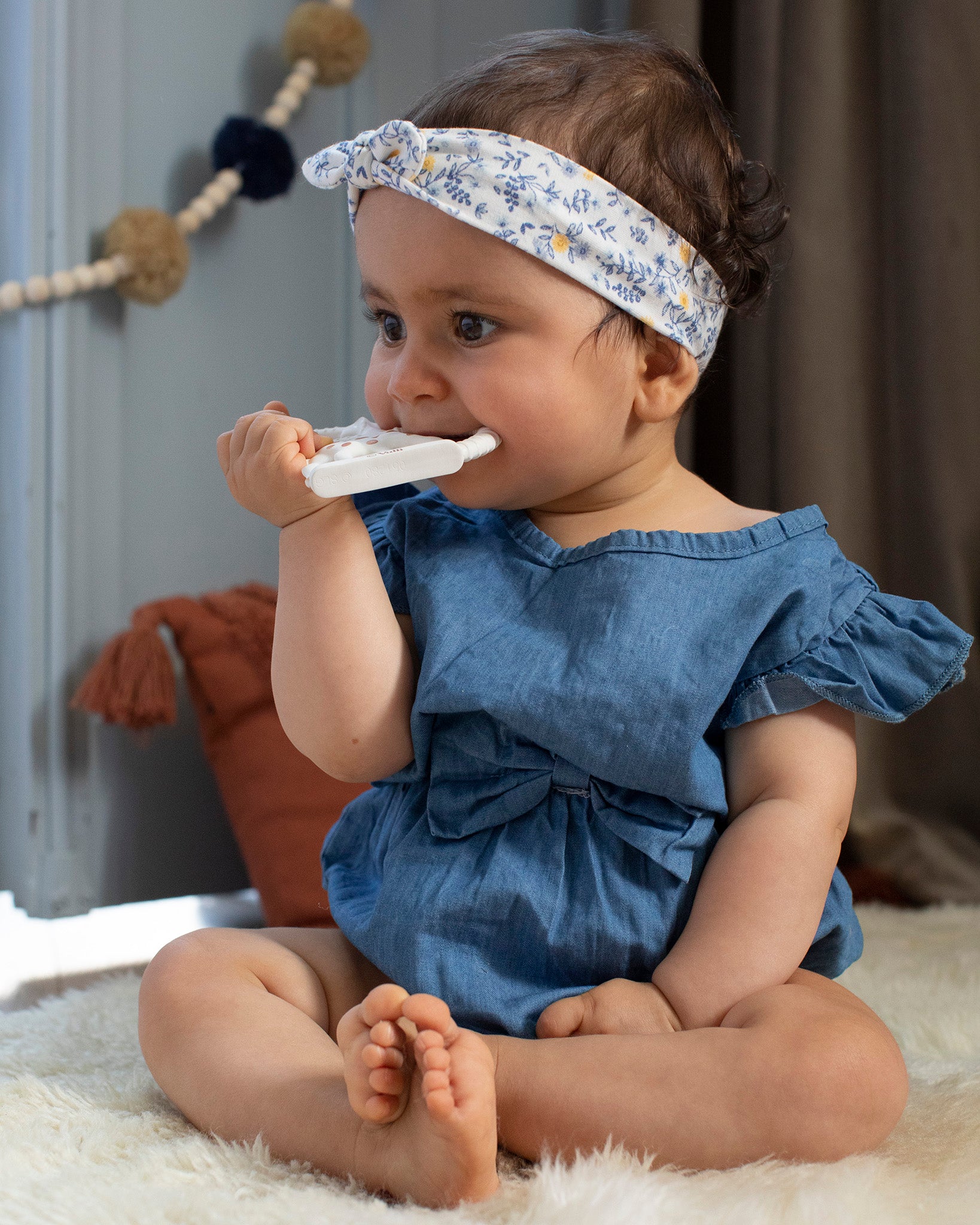 A child on a light grey sofa