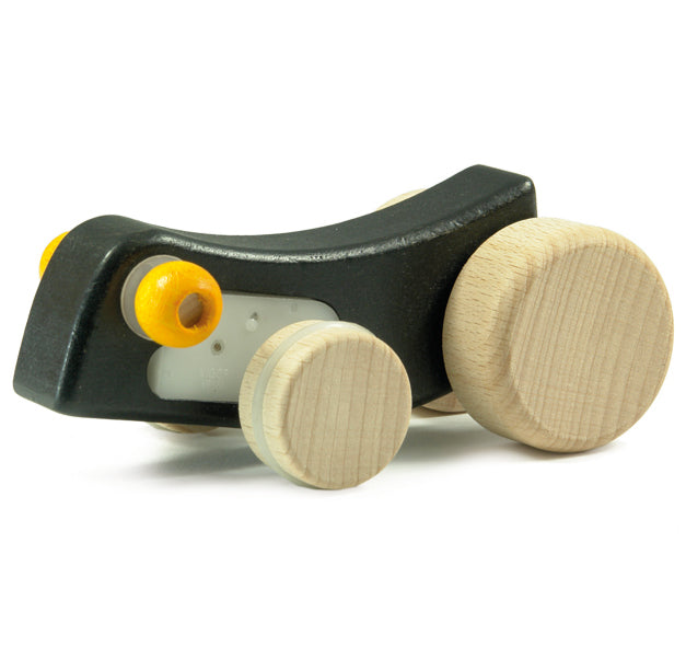 The Bajo pull back caterpillar has natural wood wheels, and a black body that moves back and forth as it is pulled back, making a fun buzzing sound as it travels