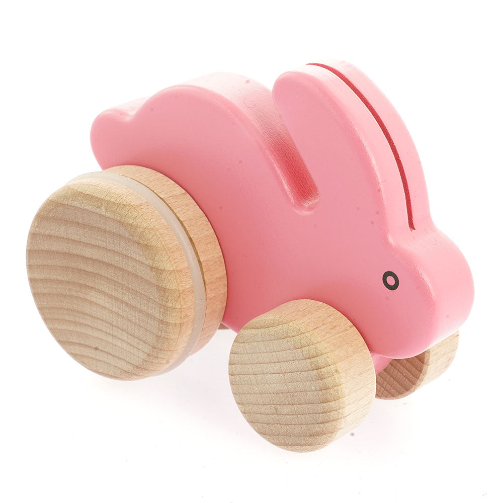 Bajo children's wooden push along bunny toy in the pink colour on a white background