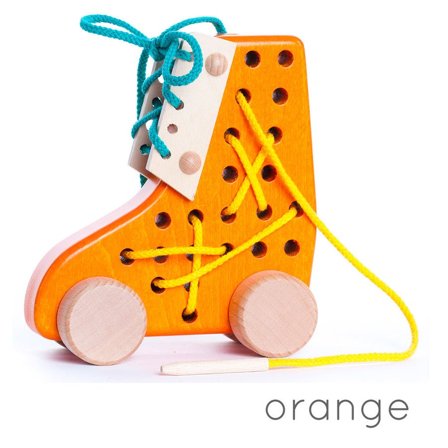 Bajo children's orange wooden lacing shoe toy on a white background