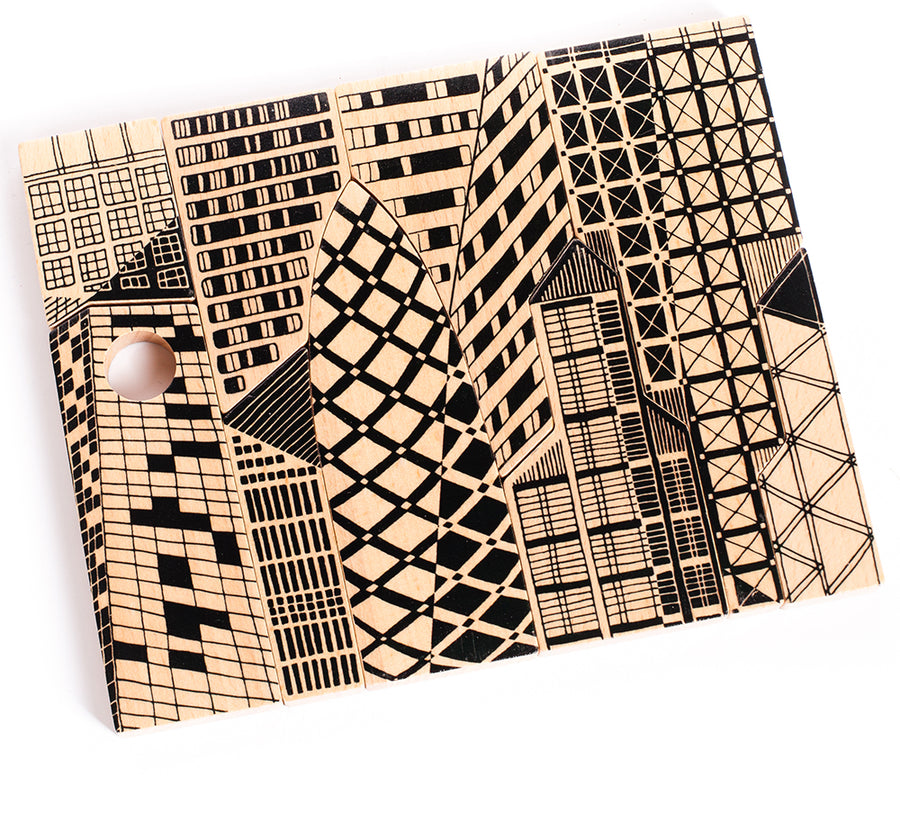 The Bajo City Puzzle is a chunky 9-piece wooden puzzle that can be used to make a striking monochrome cityscape jigsaw