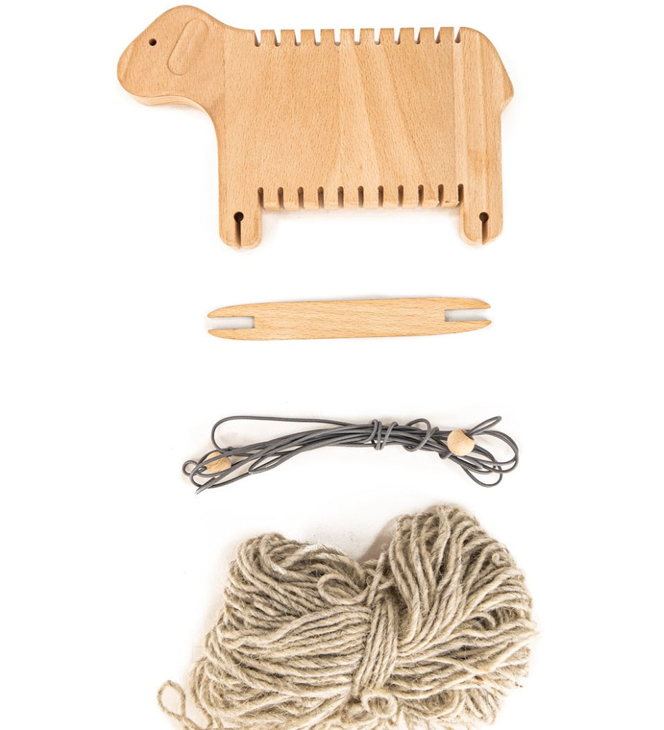 Pieces of the Bajo sustainable wooden weaving sheep set laid out on a white background