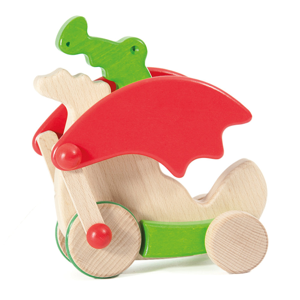 Bajo children's green pull along wooden dragon toy on a white background