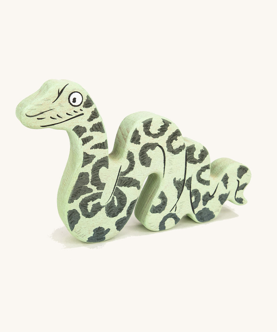 Bajo plastic-free wooden Gruffalo snake figure on a cream background