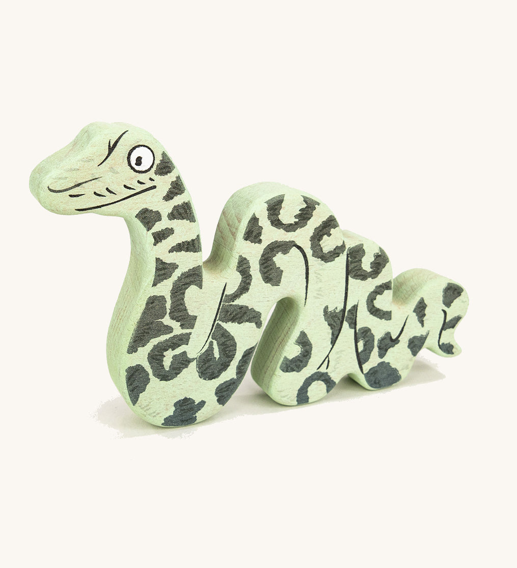 Bajo plastic-free wooden Gruffalo snake figure on a cream background