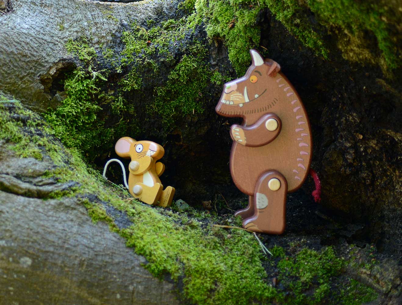 Bajo Gruffalo character wooden toys flatlay featuring Ostheimer play cloths and Babipur Lanka Kade collaboration pieces