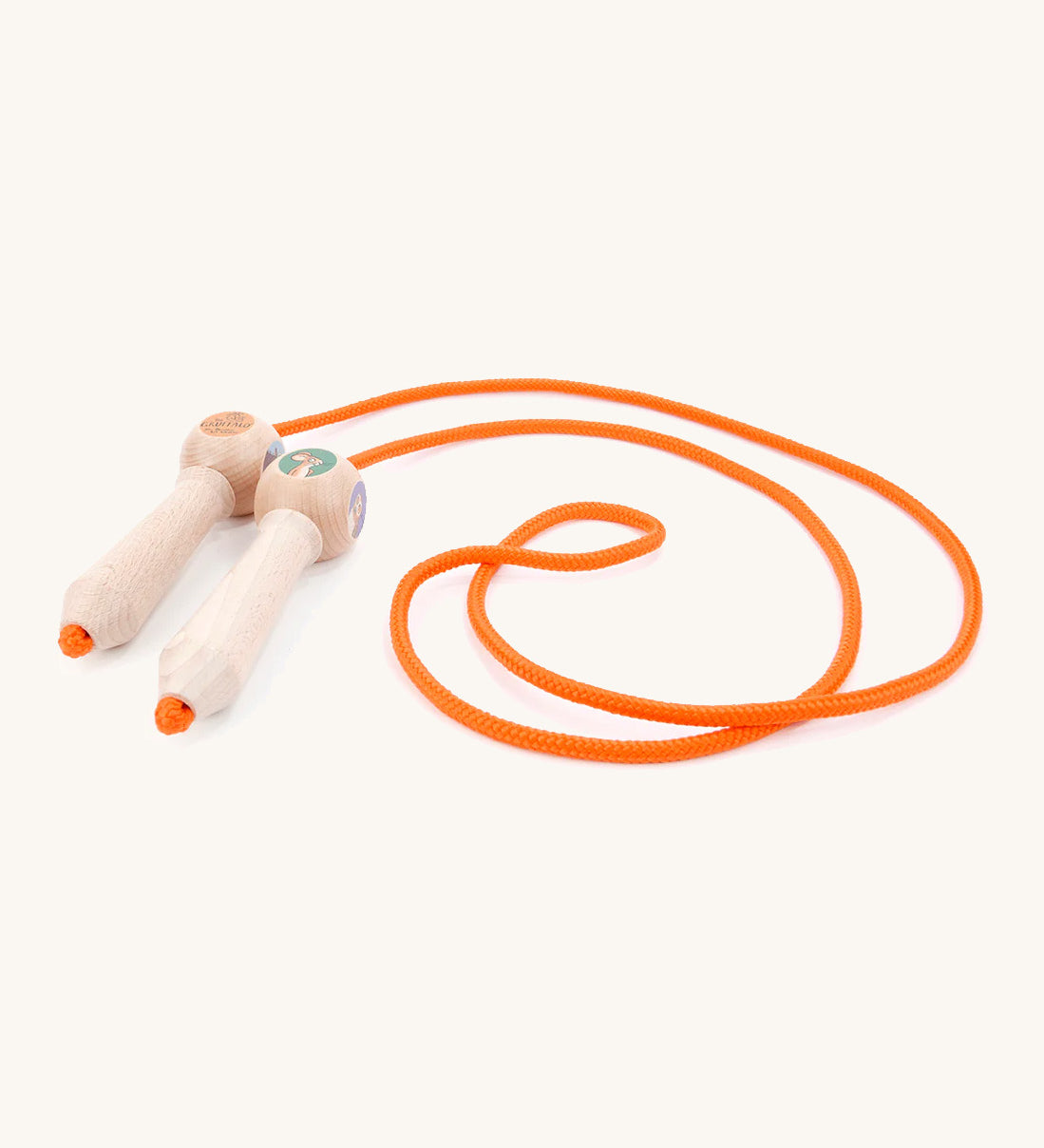 A wooden gruffalo skipping rope with orange rope on a cream background