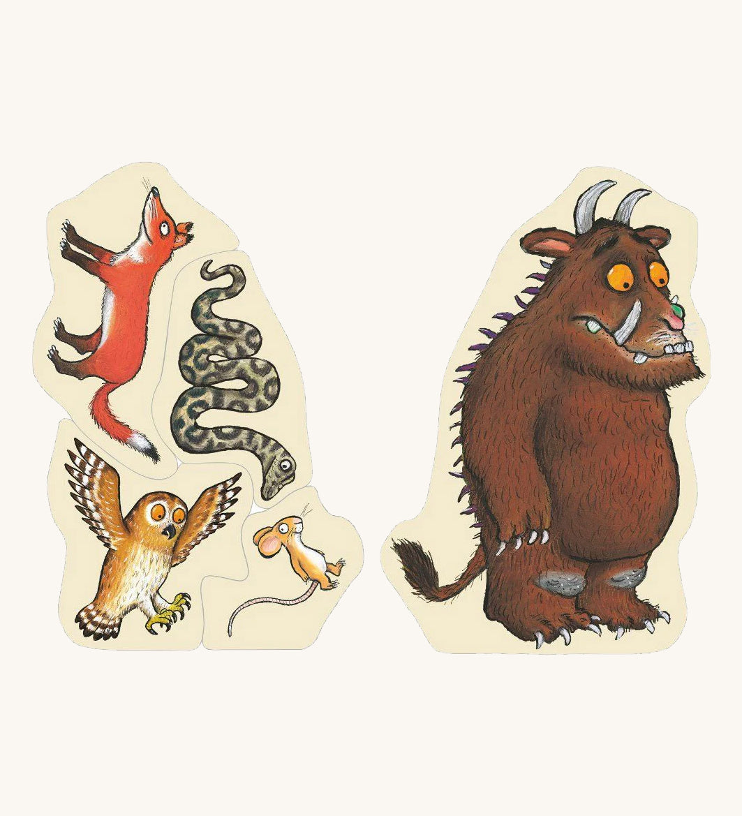 A wooden Gruffalo puzzle pieces on a cream background