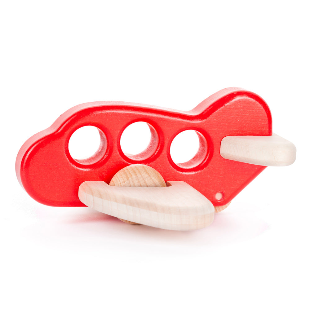 Bajo children's handmade wooden plane toy in the red colour on a white background