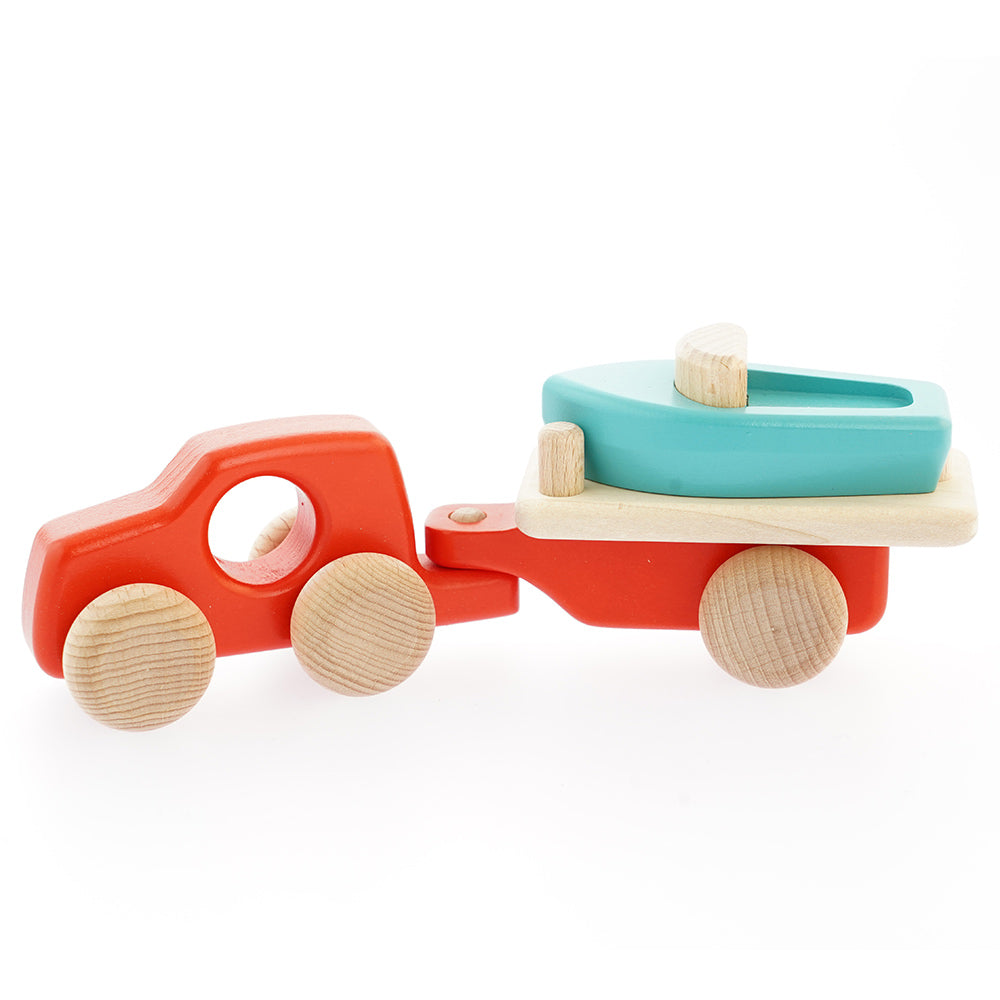 Bajo eco-friendly wooden boat and car toy on a white background