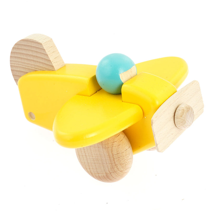 Bajo children's handmade wooden plane with pilot toy in the yellow colour on a white background