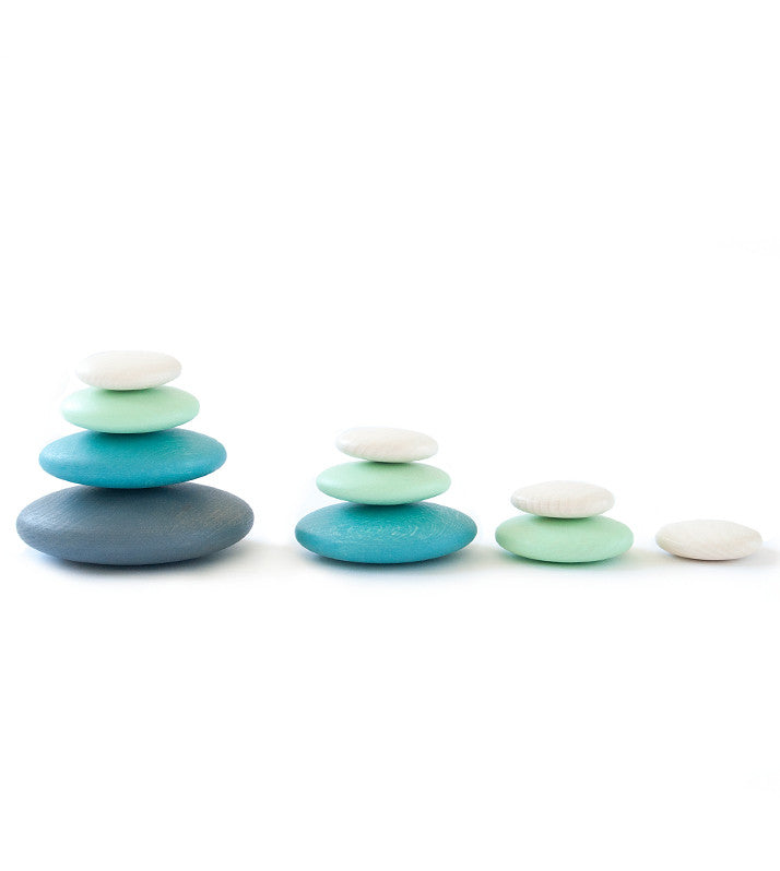 Build and stack with these wonderfully smooth and tactile 10 round wooden Pebbles by Bajo in shades of blue