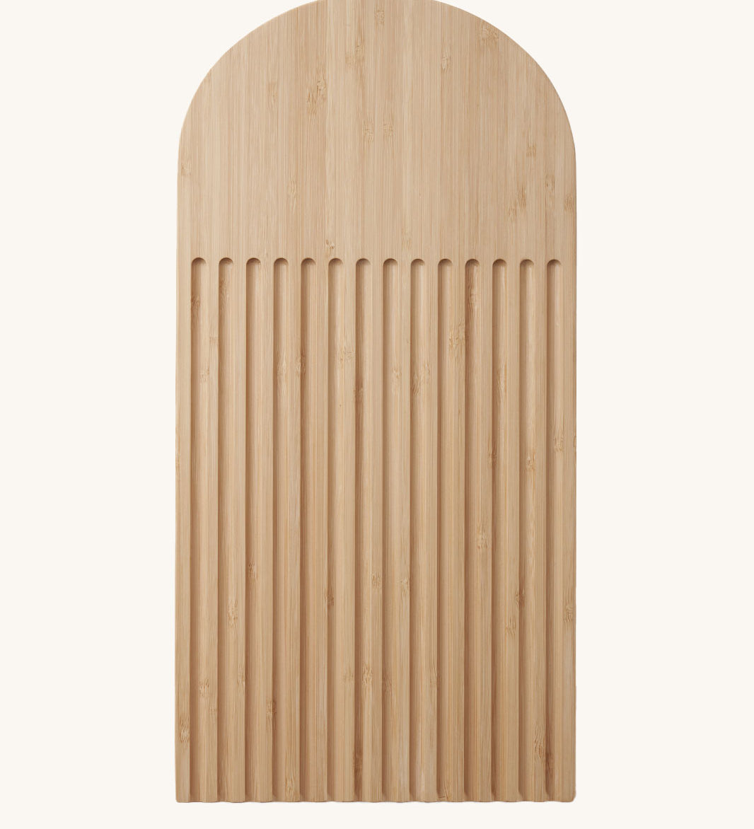 A Bambu bamboo Arch Bread Board with crumb catching ridges