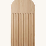 A Bambu bamboo Arch Bread Board with crumb catching ridges