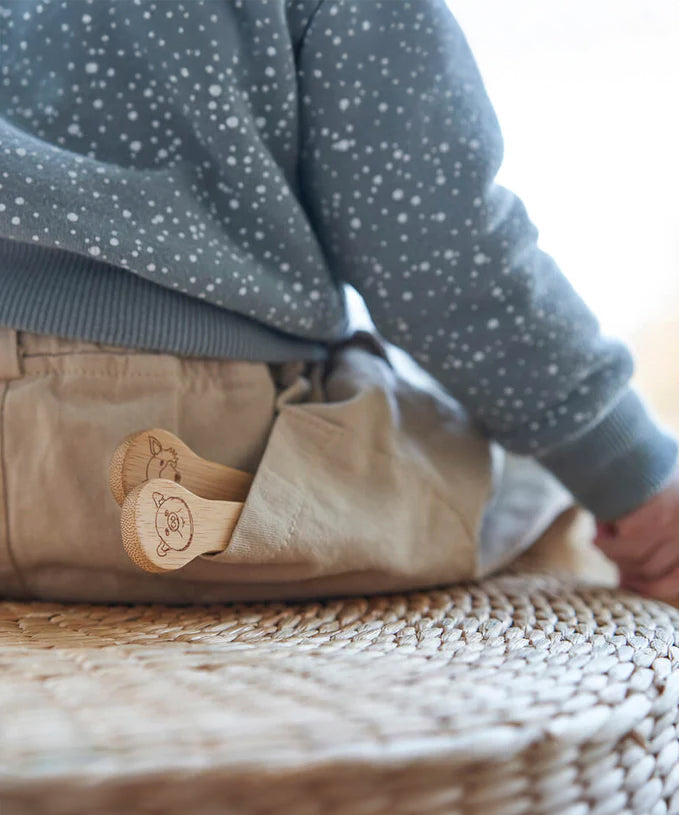 The Bambu Kids Fork & Spoon shown in a child's back pocket.