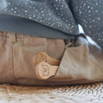 The Bambu Kids Fork & Spoon shown in a child's back pocket.