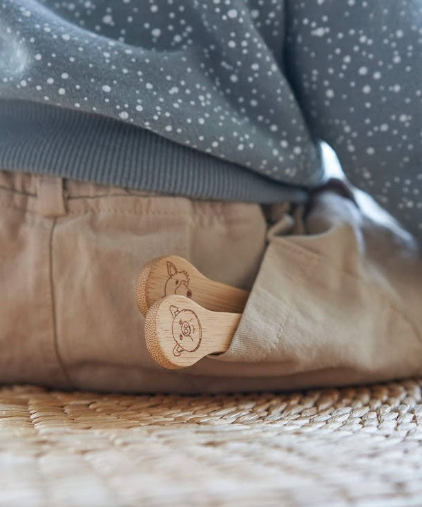 The Bambu Kids Fork & Spoon shown in a child's back pocket.