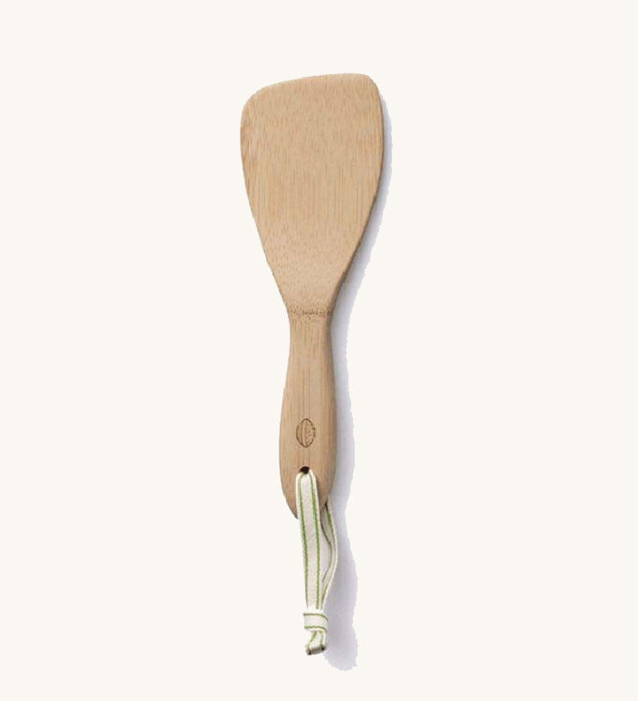 A Bambu Bamboo Rice Paddle on a plain background. 