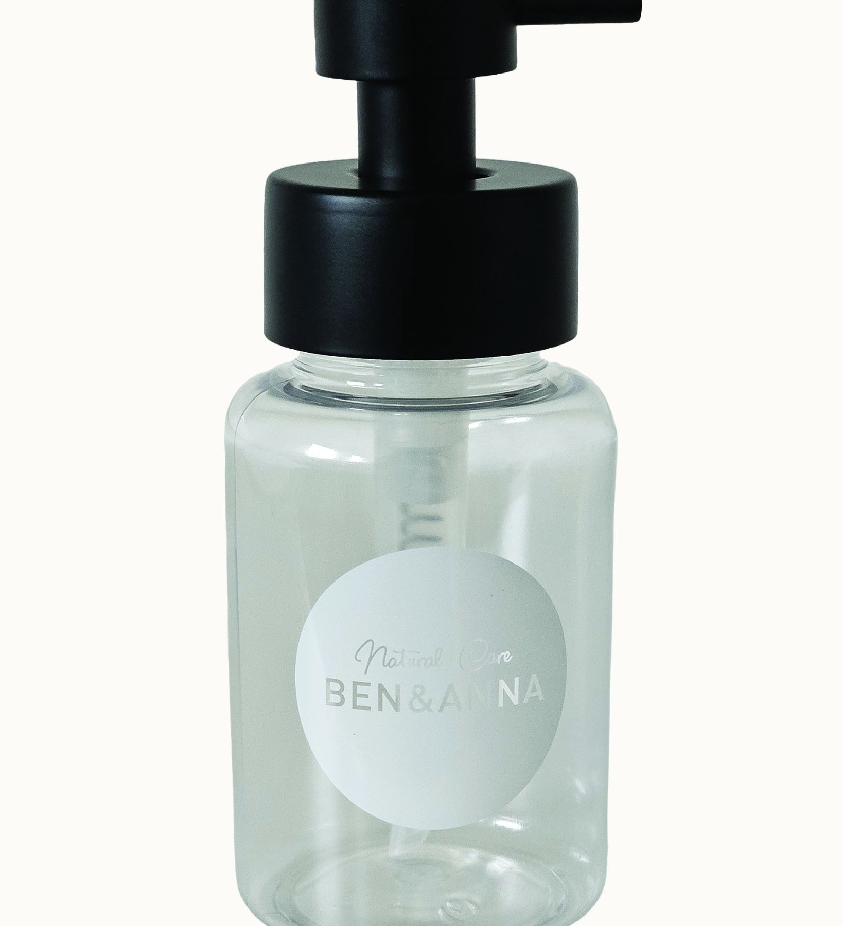 Ben & Anna Shower Gel Flakes Dispenser with black lid, on a cream background