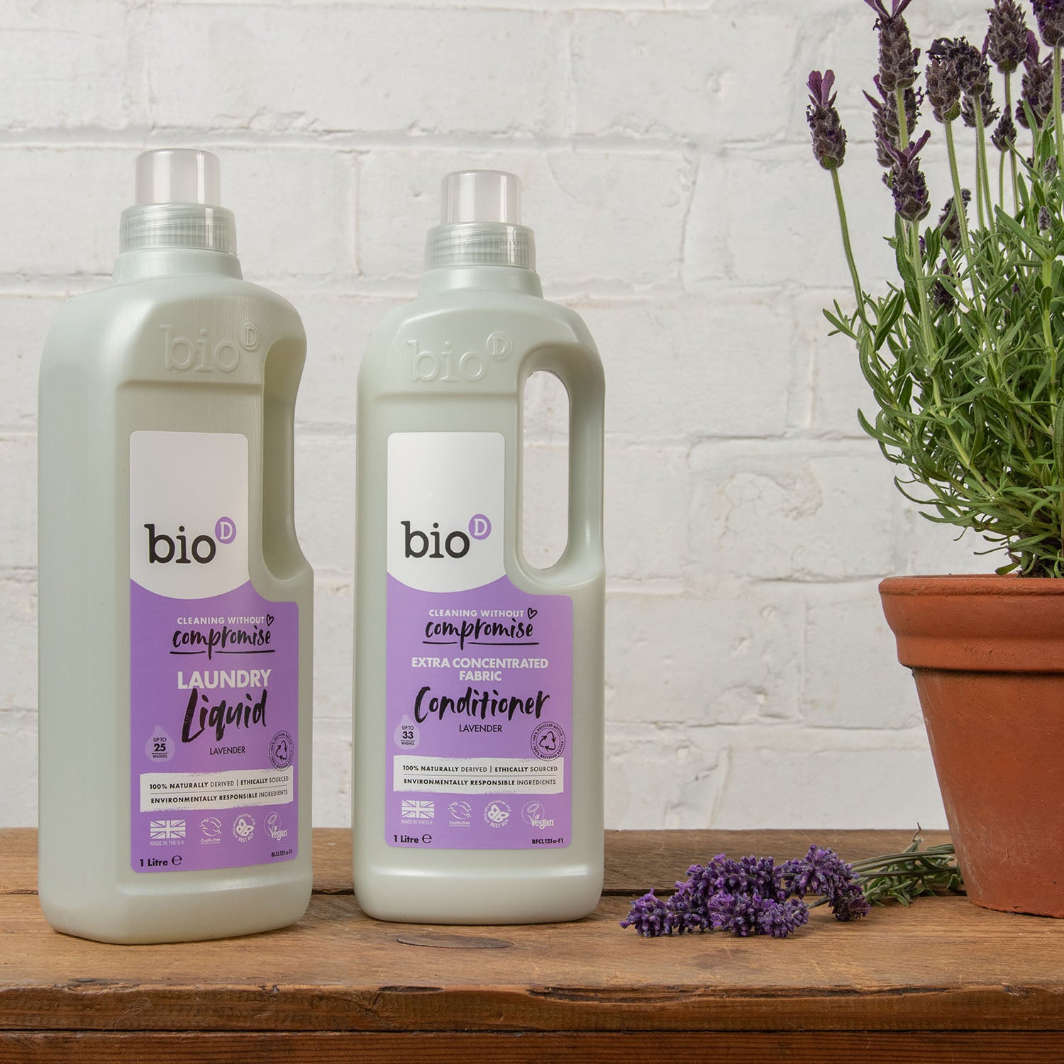 Bio D eco-friendly vegan lavender laundry liquid 1L bottle and conditioner 1 Litre bottle on a white brick back ground