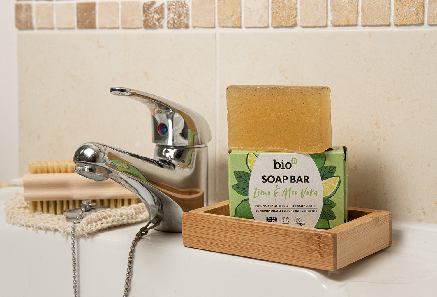 Bio-D natural Vegan aloe vera and lime soap bar next to a bathroom sink