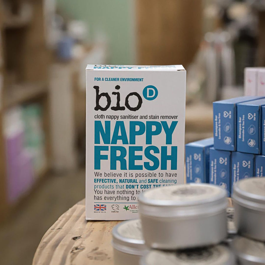 Bio-D box of nappy fresh powder 500g on a wooden table