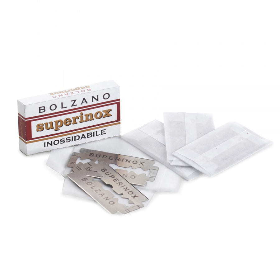 5 Bolanzo stainless steel razor blades laid out on a white background next to their cardboard box