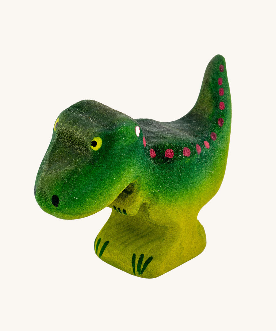 Bumbu Baby Wooden T-Rex Dinosaur on a plain background.