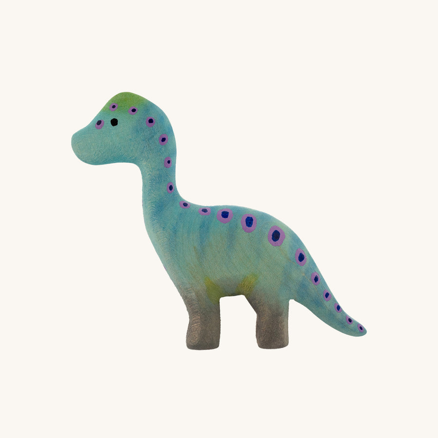 Bumbu Baby Brontosaurus pictured on a wooden surface